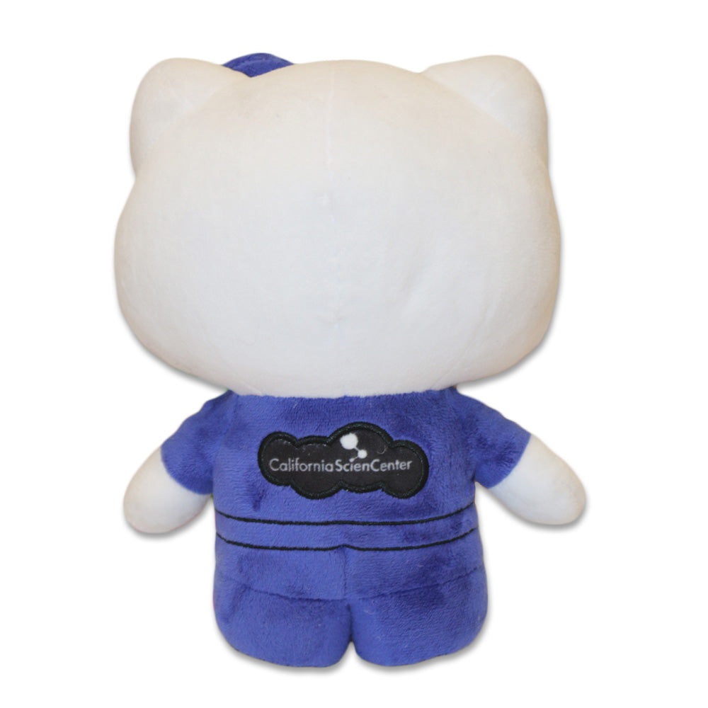 The Hello Kitty Pilot Plush is shown from the back, featuring cat-like ears and a blue outfit with "California Science Center" on it. The background is plain white.