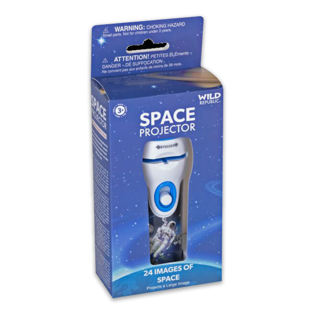A blue and white box labeled Projector Space Figurines by Wild Republic features stars, an astronaut image, and advertises 24 space exploration images for ages 3+. The star projector toy is visible inside.
