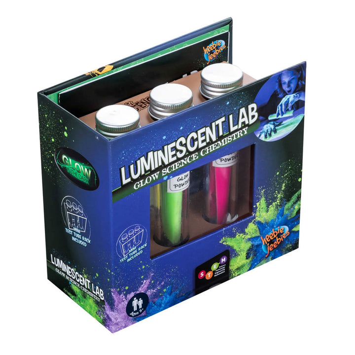 The Luminescent Lab Glow Science Chemistry set comes in a box featuring bright, glowing paint splatters and an image of a child performing photoluminescence experiments with three included bottles and test tubes—just like creating the effects you see in glow sticks.