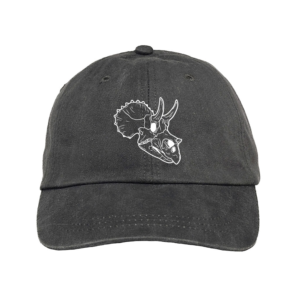 The Museum of Science Boston Cliff the Dino Skull Cap is a black cap featuring a white outline drawing of a triceratops dinosaur skull on the front—an ideal gift for paleontologists.